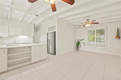 Dining area facing kitchen with stainless steel fr