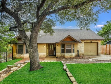 View of front of property featuring stone siding,