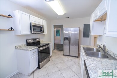 Fresh white paint and white cabinets brighten up the kitchen!
