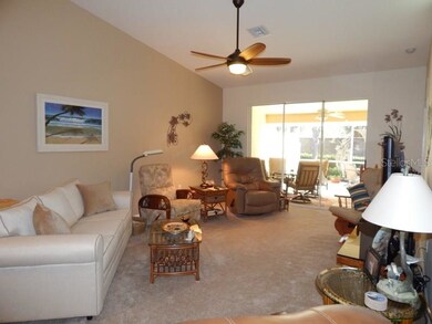 Vaulted ceiling and open floor plan .