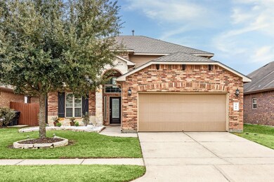 This beautiful two-story brick home features a spa