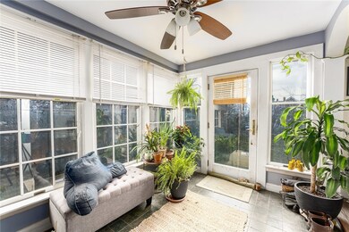 Sunroom with door to Back Yard