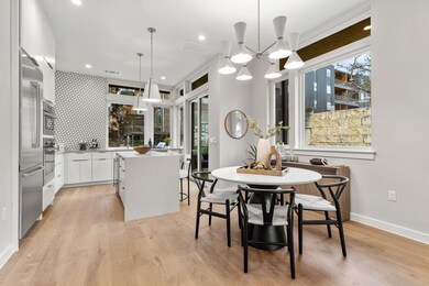 Dining space with light wood finished floors, rec