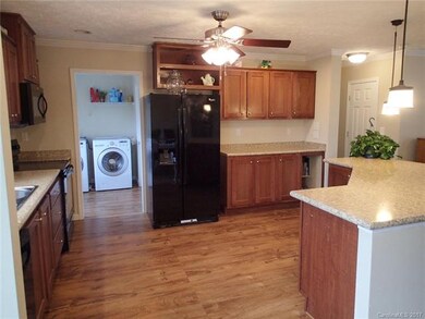 Mudroom with washer/dryer hook up and another entr