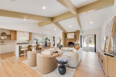 Living room with french doors, arched walkways, va