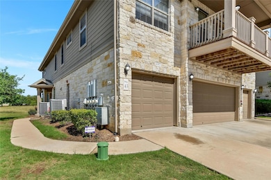 View of home's exterior with stone siding, an att