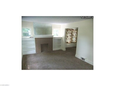 Another view of the living room features fireplace
