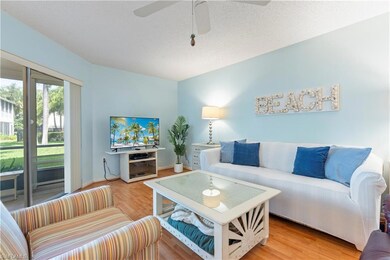 Living room with a ceiling fan and light wood finished floors
