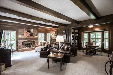 This dynamic living room also has a library/game a