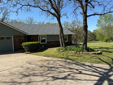 View of front of property featuring stone siding,