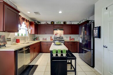Kitchen with stainless steel LG appliance package
