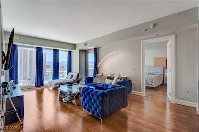 Living area featuring hardwood / wood-style floori