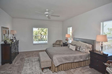 Carpeted bedroom featuring baseboards and ceiling