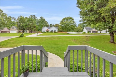 Deck with a residential view and a lawn