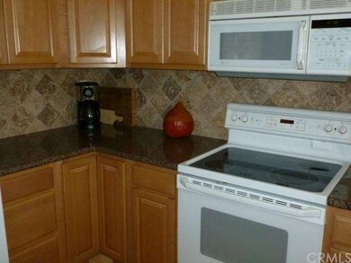 Custom Travertine backsplash, updated appliances