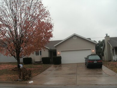 Extra wide concrete driveway.