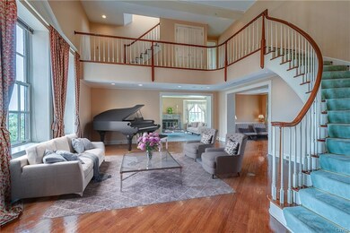 The high ceiling, large windows and soaring stairc