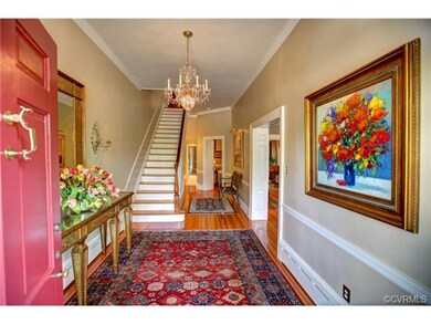 Grand Foyer entrance.  Hardwood floors, crown molding and chairrail.  Heavy moldings through out home