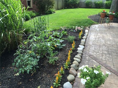 Lovely level backyard with gorgeous stamped patio