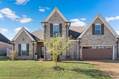 View of front of property featuring a garage and a