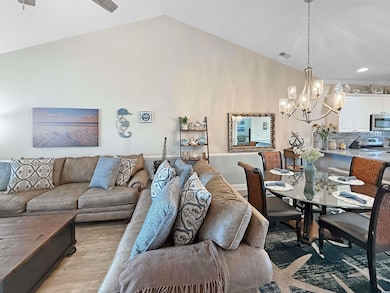 Dining room with a notable chandelier, visible ven