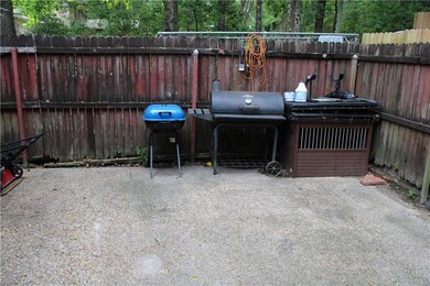 View of patio / terrace with fence and a grill