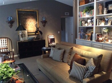 Living Room: Vaulted ceiling adds another dimension to this spacious room.