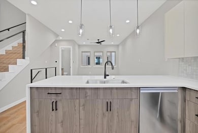 Kitchen featuring stainless steel dishwasher, mode