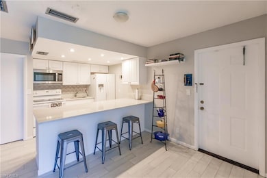 Kitchen featuring white appliances, sink, kitchen 