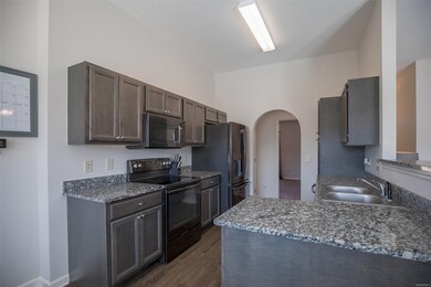 Kitchen sports upgraded granite counter tops and p