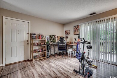 Workout area with wood-type flooring and a texture