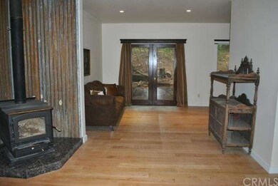 living room: new oak wood floors and wood stove wi