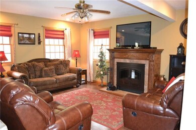 Sunny livingroom with gas ventless fireplace.