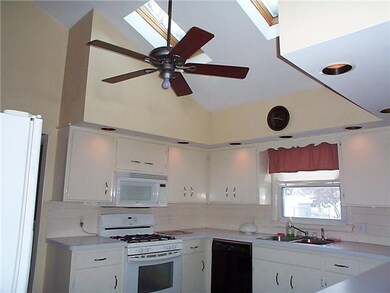 Kitchen Bright open kitchen features vaulted ceili