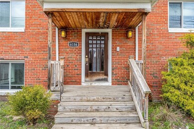 Doorway to property with brick siding