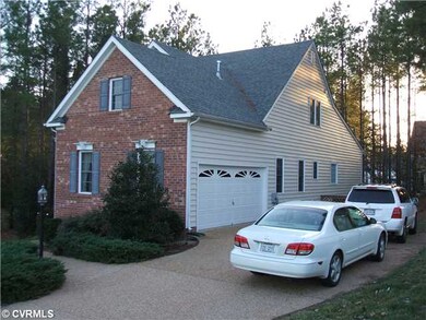 Exterior Front - Aggregate driveway with 2 car, si