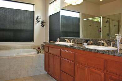 Double sinks/tub/glass shower