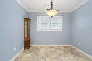Spare room featuring ornamental molding
