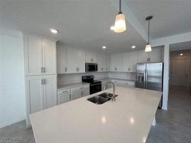 Kitchen with appliances with stainless steel finis