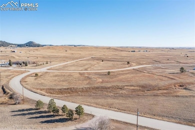 Birds eye view of property featuring a rural view