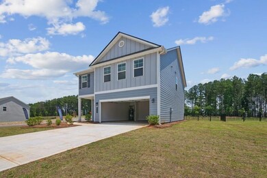 View of front of home featuring a carport and a fr