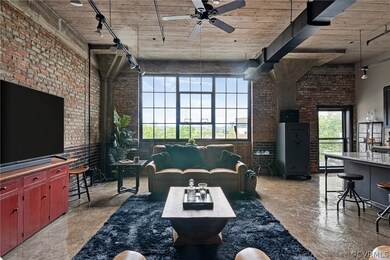 Living room featuring  exposed bricks, newly refin