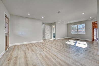 Unfurnished living room featuring recessed lightin