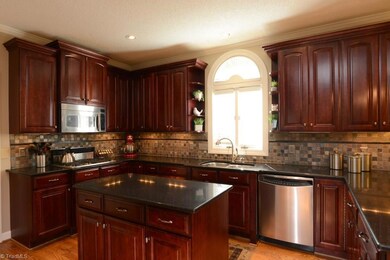 Gourmet kitchen with SS appliances, granite countertops and large island