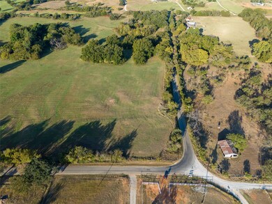 Birds eye view of property with a rural view