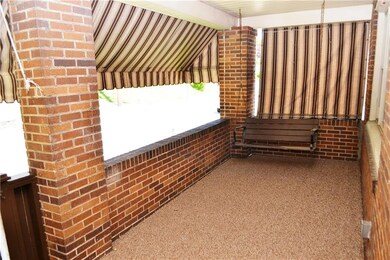 Spacious and Shaded Front Porch