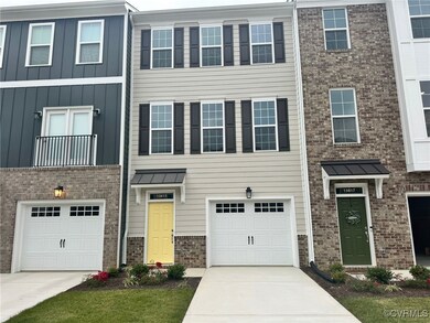 View of property featuring a garage