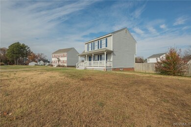 View of front of property with a front yard and a porch