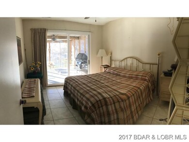 Master Bedroom off screened dk