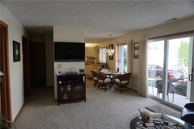 Living room open to dining and kitchen